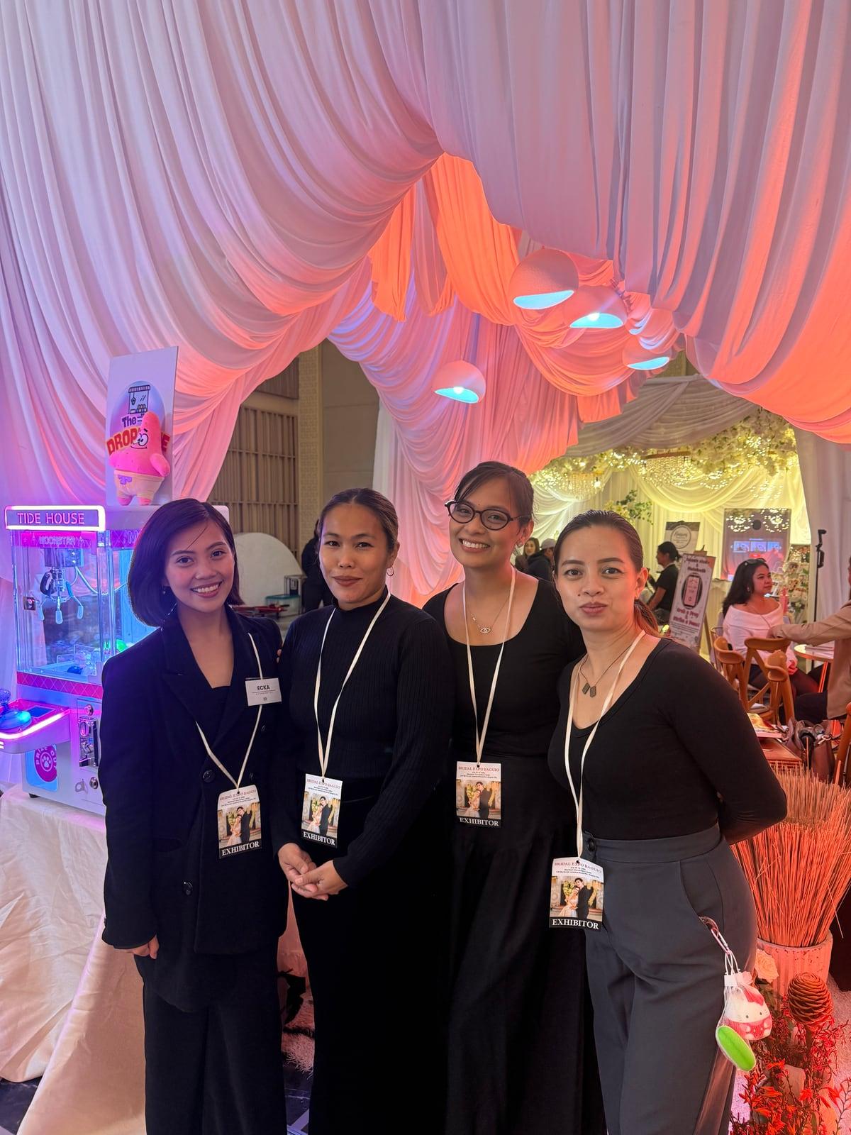 Four of the SG Events & Coordination team in black, wearing exhibitor badges at Bridal Expo Baguio
